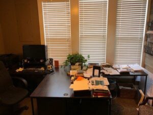One organized desk and one disorganized desk